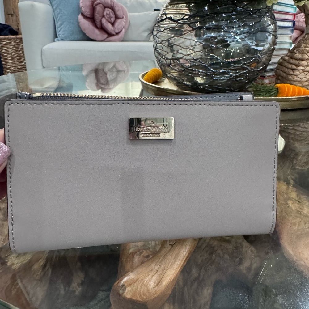 kate spade gray zip-around wallet with metal logo plaque